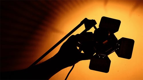 Silhouette of Hand Holding Light Panel with Barn Doors