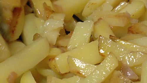 Frying Potatoes in a Pan, Close Up