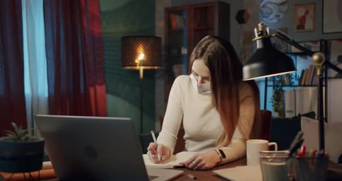 Woman Wearing Face Mask Working At Home