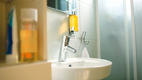 Woman Washing Hands With Liquid Soap