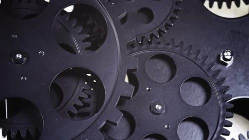 Rotating Black Gears in Close Up Footage