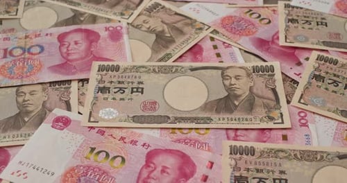 Close-up of Japanese Yen and Chinese Yuan Currency