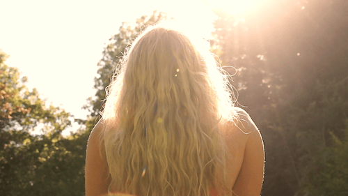 Woman With Blonde Hair in Sunny Nature Setting