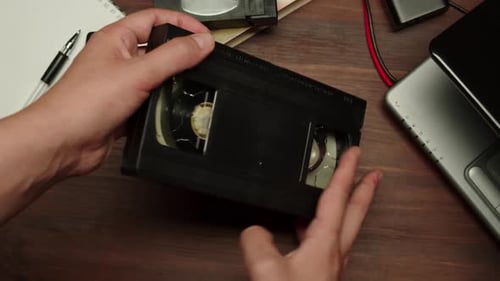 Hands Holding Old Video Cassette Closeup
