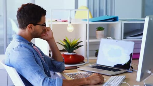 Young Professional Working at Computer in Bright Office