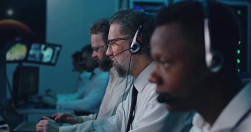 Male Operators Working in Control Center