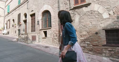 Romantic Couple Walking Visiting Rural Town of Assisi.Orbit Around. Friends Italian Trip in Umbria