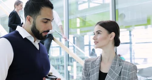 Business People. Man And Woman Talking At Work In Office