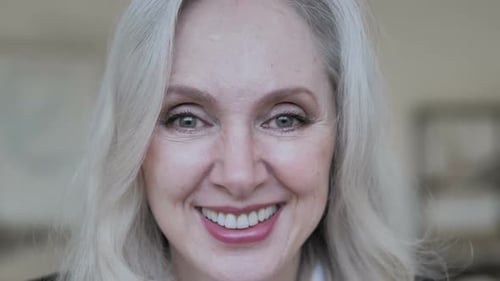Close Up of Smiling Aged Business Woman