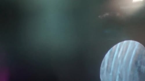 Abstract Light Leaks Shimmering over Dark Background