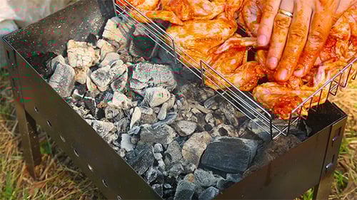 Chicken Wings on BBQ Grill with Charcoal