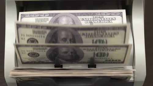 Hundred Dollar Bills Processed by Money Counter Machine