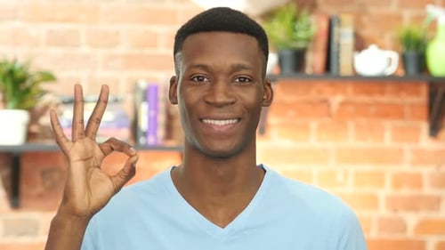 Smiling Man Gesturing Ok Sign With Hand