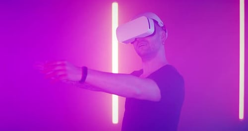 Astonished Guy in VR Headset Exploring Cyberspace