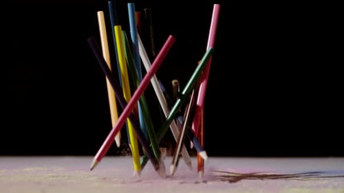 Colored Pencils Falling on a Dusty Surface
