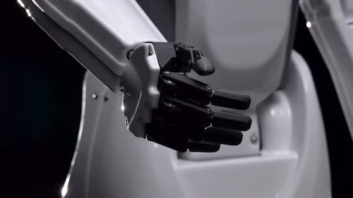 Die Hand des Roboters bewegt seine Finger Hallo. Schwarzer Hintergrund. Nahaufnahme