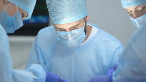 Concentrated Surgical Team Operating in Clinic, Plastic Surgery, Health Care