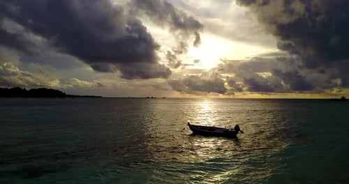 Tropical fly over island view of a sunshine white sandy paradise beach and blue ocean background
