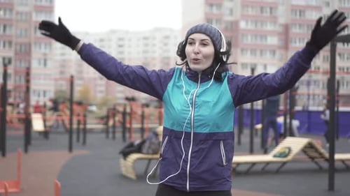 Woman Exercising in Colorful Outdoor Workout Area