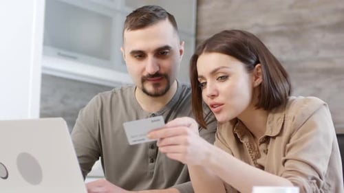 Happy Couple Buying Item from Online Store at Home