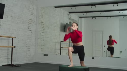 Sporty Fitness Woman Doing Box Step Up Exercise at Gym