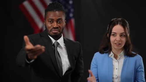 Professionals Talking in Front of American Flag