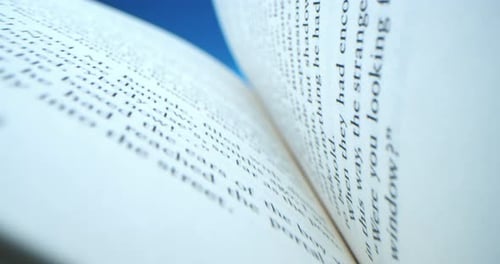 Macro shot of open book with pages and text
