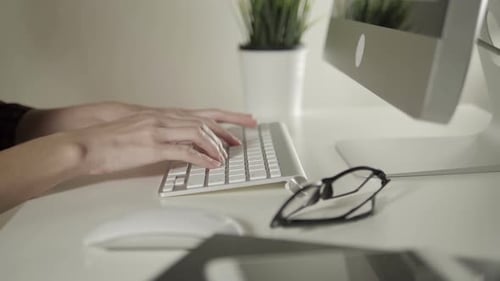 Female Working On Computer In Office