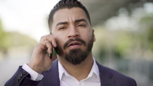 Man in Suit Talking on Cell Phone Close Up
