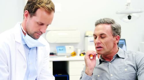 Patient discussing dental problem with dentist