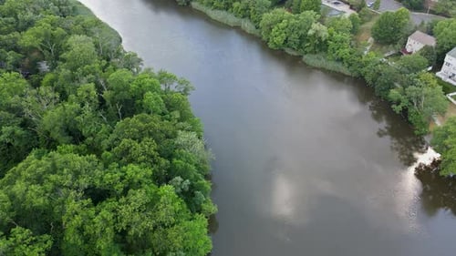 Cityscape of Residential Private Houses Rooftop with a Town Areas Along the River