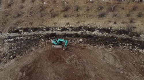 Excavator Digging in Rural Landscape, Aerial View