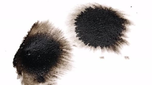 Black Ink Drops On White Background
