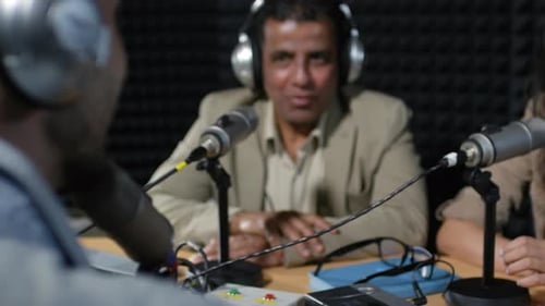 Radio Host Chatting with Guests