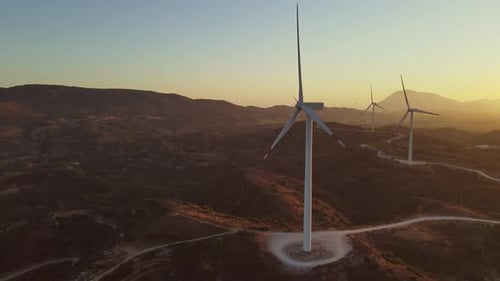 Scenic Aerial of Wind Turbines at Sunrise