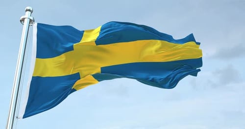 Waving Sweden National Flag against Blue Sky