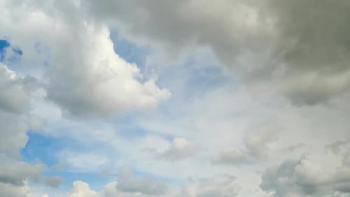 White cumulus clouds in the blue sky, timelapse. Bright beautiful sky, copy space background