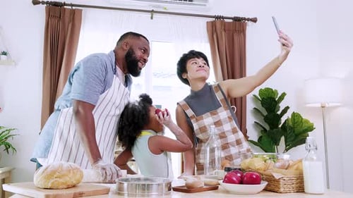 Cheerful Family Baking and Taking Selfie in Kitchen
