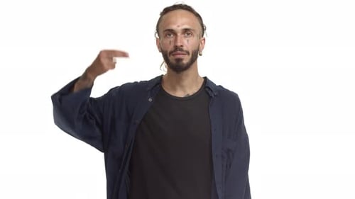 Adult Man Poses with Finger Gun Gesture