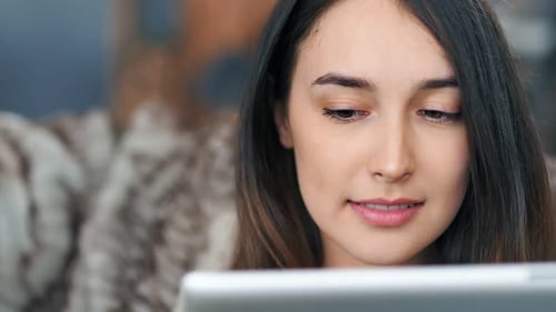 Woman Using Tablet Indoors, Close Up