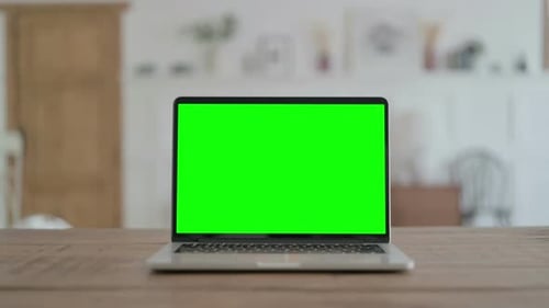 Open Laptop with Green Screen on Desk Chrome Key