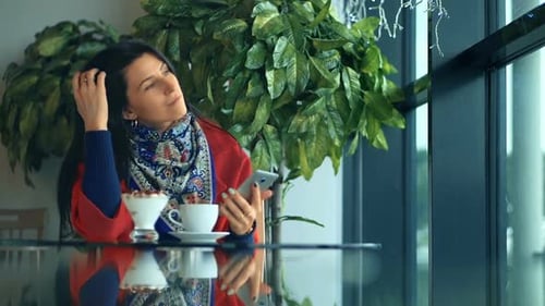 Charming Businesswoman Drinking Coffee in Cafe