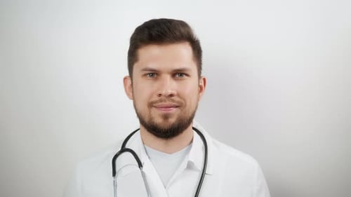 Smiling Male Doctor in White Coat Close Up