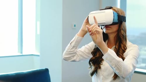 Woman Experiencing Virtual Reality in Modern Office
