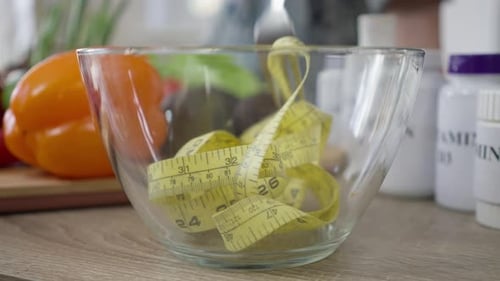 Measuring Tape is Mixed in Clear Bowl