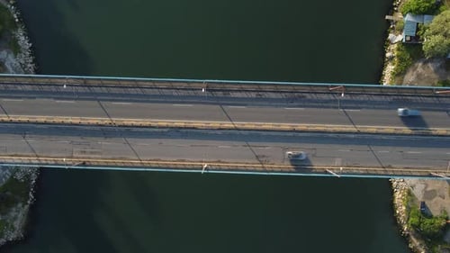 Aerial View of a Bridge Over a Large River with Heavy Traffic