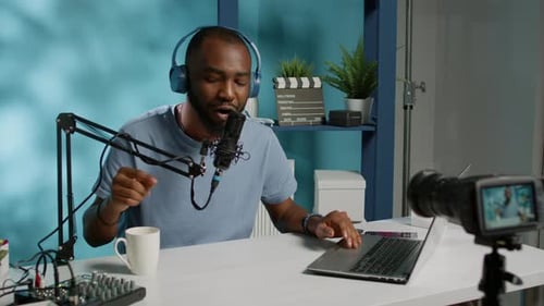 Man Recording a Podcast in Home Studio
