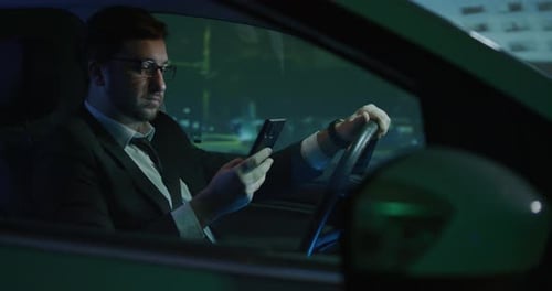 Man Answering Phone Call While Driving
