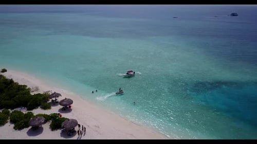 Aerial drone shot seascape of perfect coast beach trip by turquoise sea with white sandy background