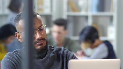 Serious Afro-American Software Developer Posing